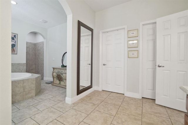 1116 Hillandale Reserve Dr, Tampa, FL 33613 - full bathroom featuring tile patterned flooring, a bath, and baseboards
