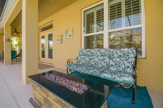 1116 Hillandale Reserve Dr, Tampa, FL 33613 - view of patio featuring french doors, outdoor dining space, and a fire pit
