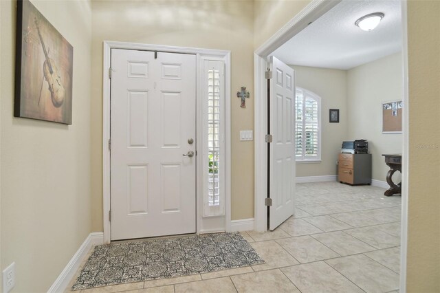 1116 Hillandale Reserve Dr, Tampa, FL 33613 - foyer with light tile patterned floors and baseboards