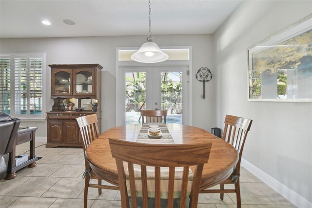 1116 Hillandale Reserve Dr, Tampa, FL 33613 - dining room with french doors, plenty of natural light, light tile patterned flooring, and recessed lighting