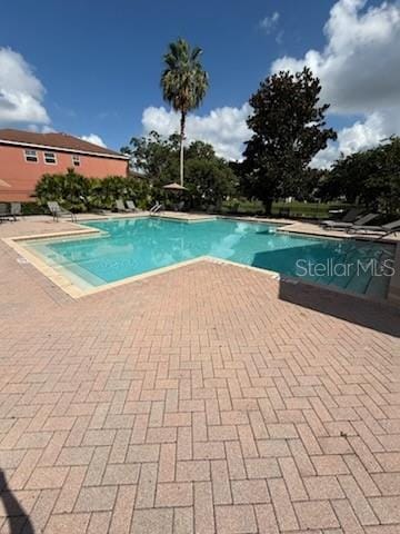 10850 Lake Saint Charles Blvd, Riverview, FL 33578 - community pool featuring a patio area
