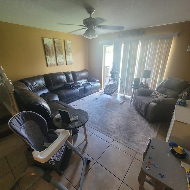 10850 Lake Saint Charles Blvd, Riverview, FL 33578 - living area with tile patterned floors, ceiling fan, carpet flooring, and a textured ceiling
