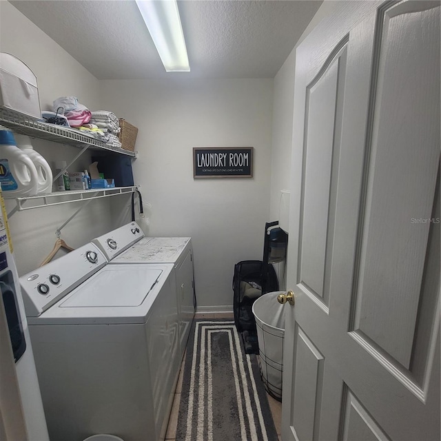 10850 Lake Saint Charles Blvd, Riverview, FL 33578 - laundry area with washer and dryer and a textured ceiling