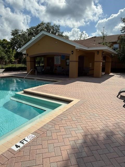 10850 Lake Saint Charles Blvd, Riverview, FL 33578 - community pool featuring a patio area