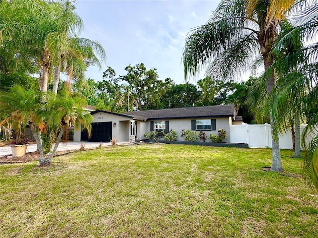 single story home featuring stucco siding, a garage, and driveway