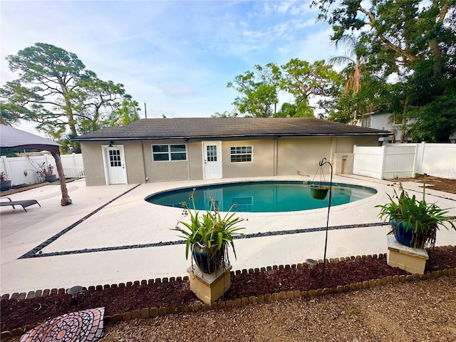 view of pool featuring a patio area, fence, and a gazebo