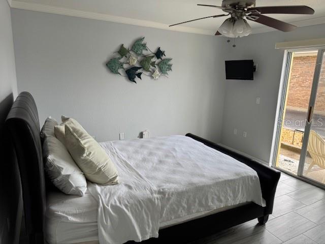 bedroom with access to exterior, ornamental molding, a ceiling fan, and baseboards