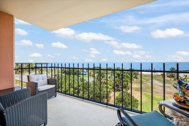 balcony featuring a water view