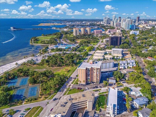 aerial view of property's location with nearby urban area and a nearby body of water