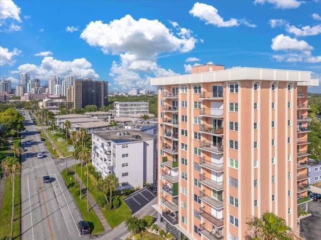 view of apartment building / complex with a city view