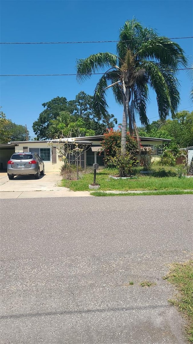 view of front of home featuring concrete driveway