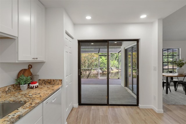 3923 Shoreside Cir, Tampa, FL 33624 - doorway to outside with light wood finished floors, baseboards, recessed lighting, and a sink