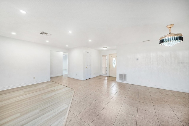 8744 Andros Ln, Port Richey, FL 34668 - spare room featuring light tile patterned floors, baseboards, and recessed lighting