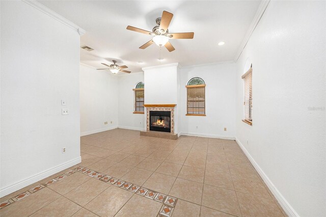8744 Andros Ln, Port Richey, FL 34668 - unfurnished living room with crown molding, light tile patterned floors, a ceiling fan, a glass covered fireplace, and baseboards