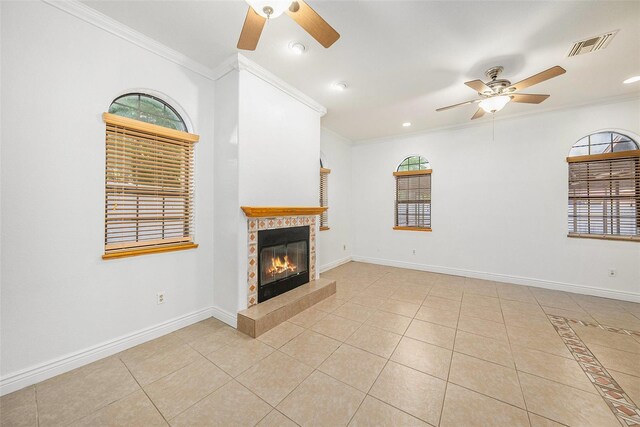 8744 Andros Ln, Port Richey, FL 34668 - unfurnished living room featuring ceiling fan, a tile fireplace, crown molding, light tile patterned flooring, and recessed lighting