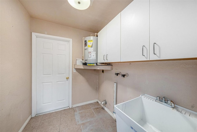 8744 Andros Ln, Port Richey, FL 34668 - washroom with water heater, cabinet space, baseboards, and hookup for a washing machine
