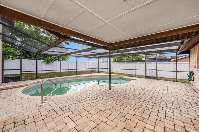 8744 Andros Ln, Port Richey, FL 34668 - view of swimming pool featuring a patio area, a fenced backyard, and a lanai