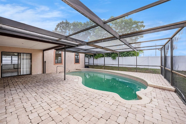 8744 Andros Ln, Port Richey, FL 34668 - view of pool featuring a patio area, a fenced backyard, and glass enclosure