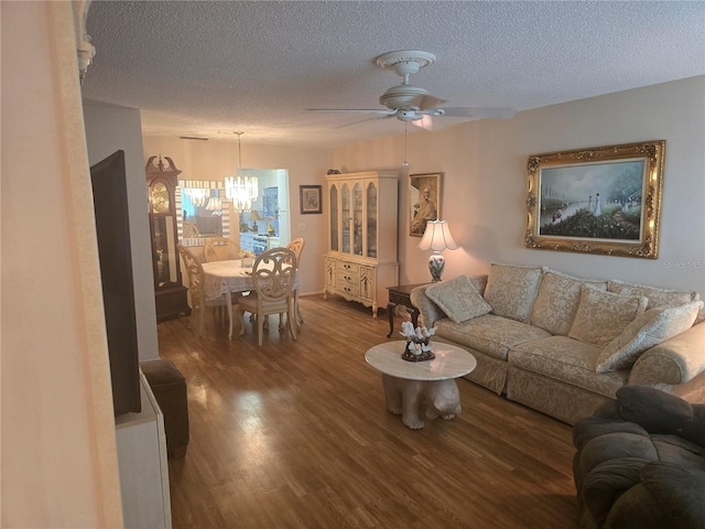 5705 80th St N Unit 303, Saint Petersburg, FL 33709 - living area featuring a chandelier, a ceiling fan, a textured ceiling, and wood finished floors