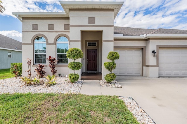 12420 Brick Cobblestone Dr, Riverview, FL 33579 - view of front of home with a garage, stucco siding, and concrete driveway