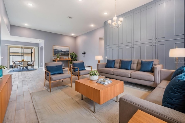 12420 Brick Cobblestone Dr, Riverview, FL 33579 - living room with light wood-style floors, a chandelier, recessed lighting, and baseboards