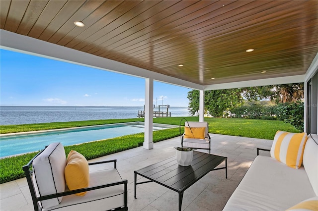 218 Colony Point Rd S, Saint Petersburg, FL 33705 - view of patio featuring a water view, an outdoor hangout area, and an outdoor pool