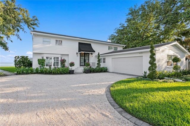 218 Colony Point Rd S, Saint Petersburg, FL 33705 - view of front of house with driveway and a garage