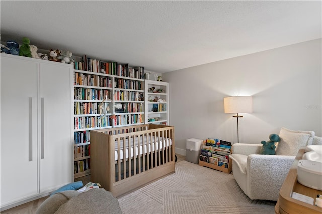 218 Colony Point Rd S, Saint Petersburg, FL 33705 - carpeted bedroom with a nursery area and a textured ceiling