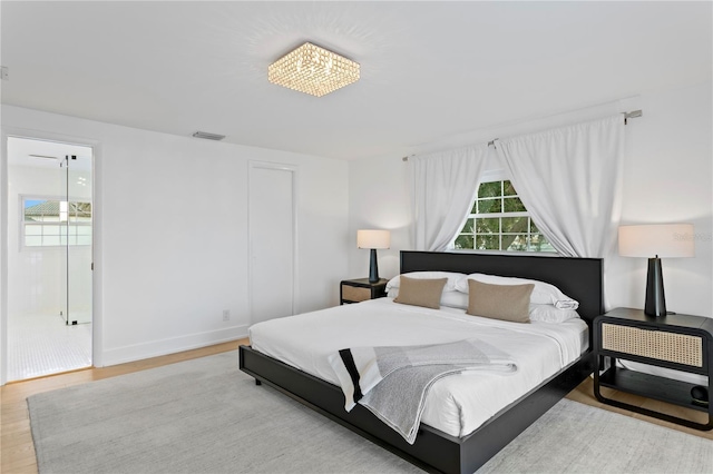 218 Colony Point Rd S, Saint Petersburg, FL 33705 - bedroom with wood finished floors and baseboards