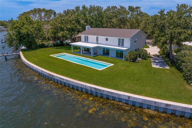 218 Colony Point Rd S, Saint Petersburg, FL 33705 - rear view of house with a water view, a yard, an outdoor pool, a chimney, and a patio