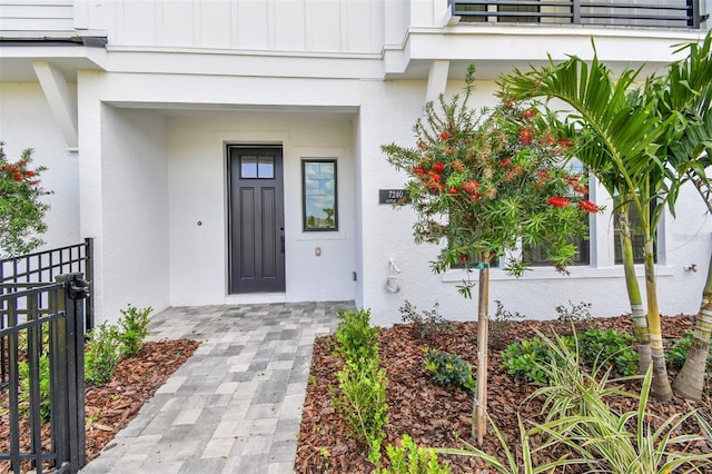 7240 Sutton Ln, Sarasota, FL 34240 - entrance to property with board and batten siding and stucco siding