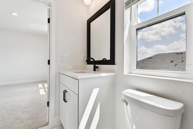 7240 Sutton Ln, Sarasota, FL 34240 - bathroom with vanity, toilet, and baseboards