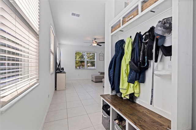 6542 95th Pl N, Pinellas Park, FL 33782 - mudroom with light tile patterned flooring, a ceiling fan, and baseboards