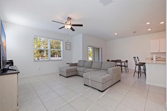 6542 95th Pl N, Pinellas Park, FL 33782 - living area with light tile patterned floors, a ceiling fan, recessed lighting, and baseboards