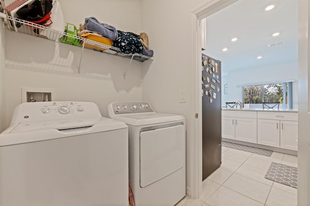 6542 95th Pl N, Pinellas Park, FL 33782 - washroom featuring independent washer and dryer, light tile patterned flooring, and recessed lighting