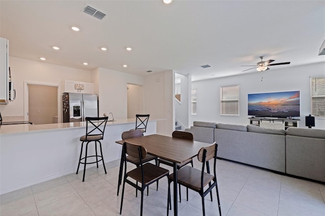 6542 95th Pl N, Pinellas Park, FL 33782 - dining area featuring stairway, ceiling fan, light tile patterned flooring, and recessed lighting