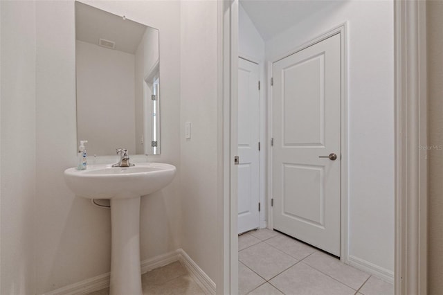 6542 95th Pl N, Pinellas Park, FL 33782 - bathroom featuring tile patterned flooring and baseboards