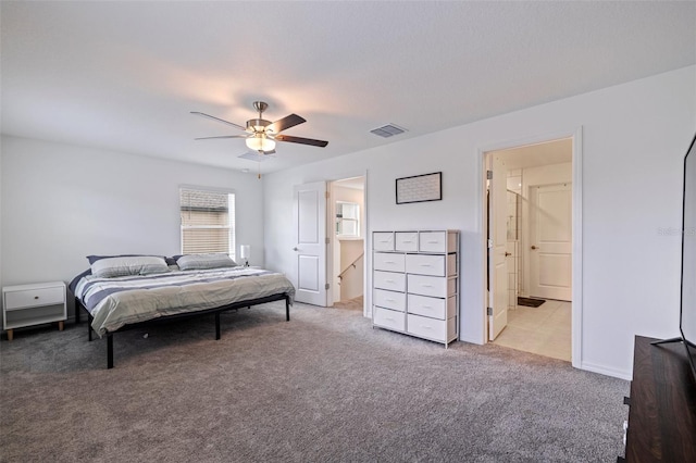 6542 95th Pl N, Pinellas Park, FL 33782 - bedroom with light colored carpet, ceiling fan, and ensuite bath