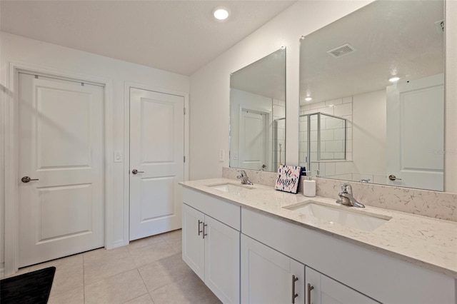 6542 95th Pl N, Pinellas Park, FL 33782 - full bathroom with double vanity, tile patterned floors, a shower, and recessed lighting