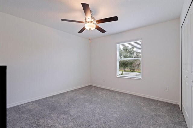 6542 95th Pl N, Pinellas Park, FL 33782 - spare room featuring carpet flooring, a ceiling fan, and baseboards