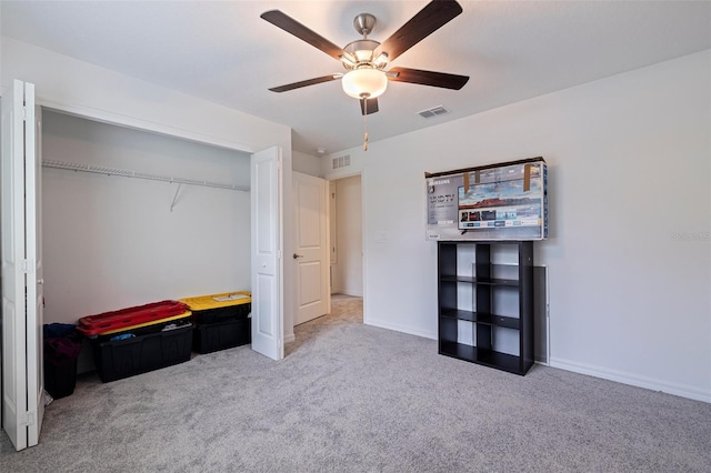 6542 95th Pl N, Pinellas Park, FL 33782 - unfurnished bedroom featuring carpet floors, a closet, a ceiling fan, and baseboards