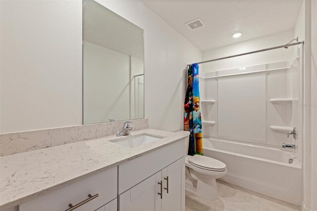 6542 95th Pl N, Pinellas Park, FL 33782 - full bathroom featuring toilet, vanity, shower / bath combo, and tile patterned flooring
