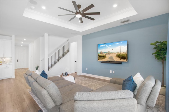 16117 Rosemallow Ln, Alva, FL 33920 - living room with a tray ceiling, stairs, recessed lighting, ceiling fan, and light wood finished floors