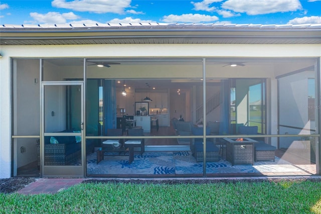 16117 Rosemallow Ln, Alva, FL 33920 - rear view of house with a sunroom, a fire pit, ceiling fan, and a patio area