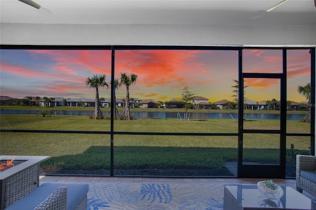 16117 Rosemallow Ln, Alva, FL 33920 - unfurnished sunroom featuring a water view and a residential view