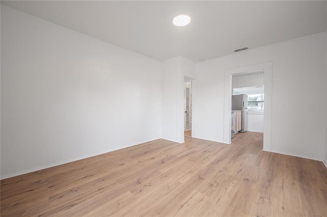 1527 E Lake Ave, Tampa, FL 33610 - unfurnished room featuring light wood-style flooring