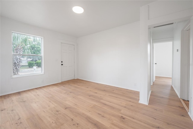 1527 E Lake Ave, Tampa, FL 33610 - unfurnished room featuring light wood-style flooring and baseboards