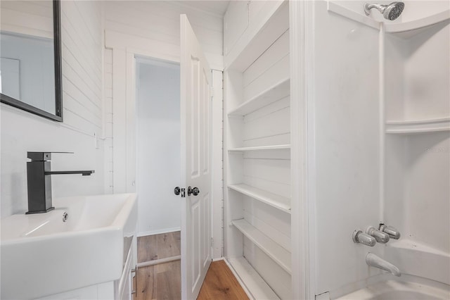 1527 E Lake Ave, Tampa, FL 33610 - bathroom featuring a sink and wood finished floors