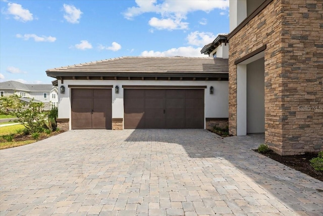 33750 Ocean Spray Ln, Wesley Chapel, FL 33543 - garage with decorative driveway