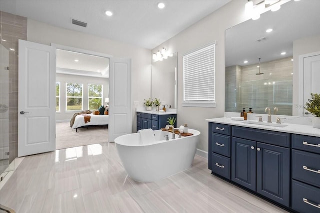 33750 Ocean Spray Ln, Wesley Chapel, FL 33543 - ensuite bathroom with a stall shower, recessed lighting, vanity, a freestanding bath, and baseboards
